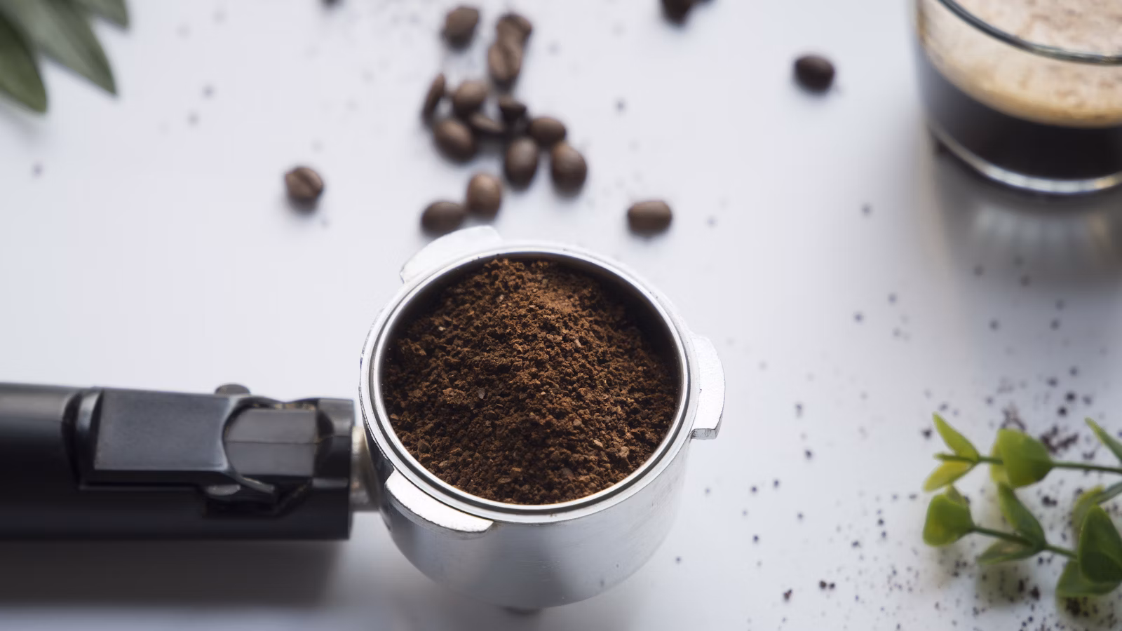 Grained coffee in gray stainless steel container